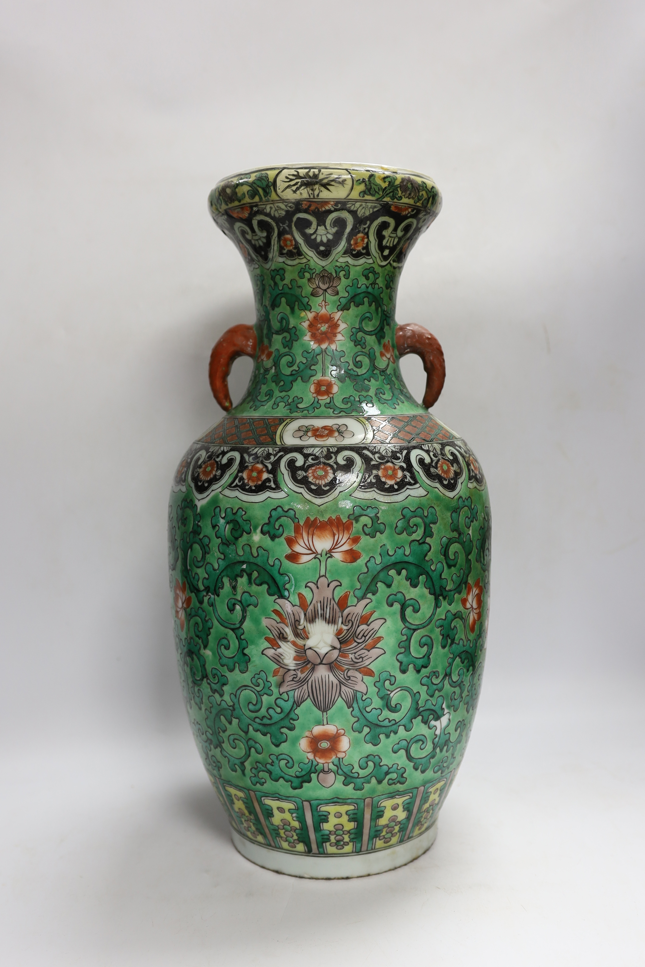 A Chinese green ground enamelled porcelain vase, Kangxi mark but late 19th century, 45cm